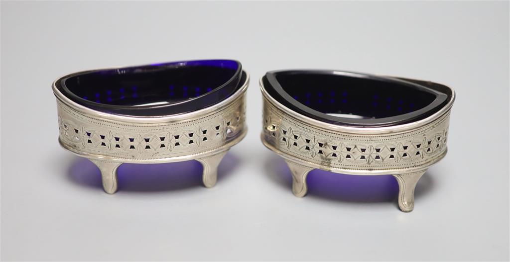 A pair of George III pierced silver navette shaped salts, Soloman Hougham, London, 1797, 89mm.